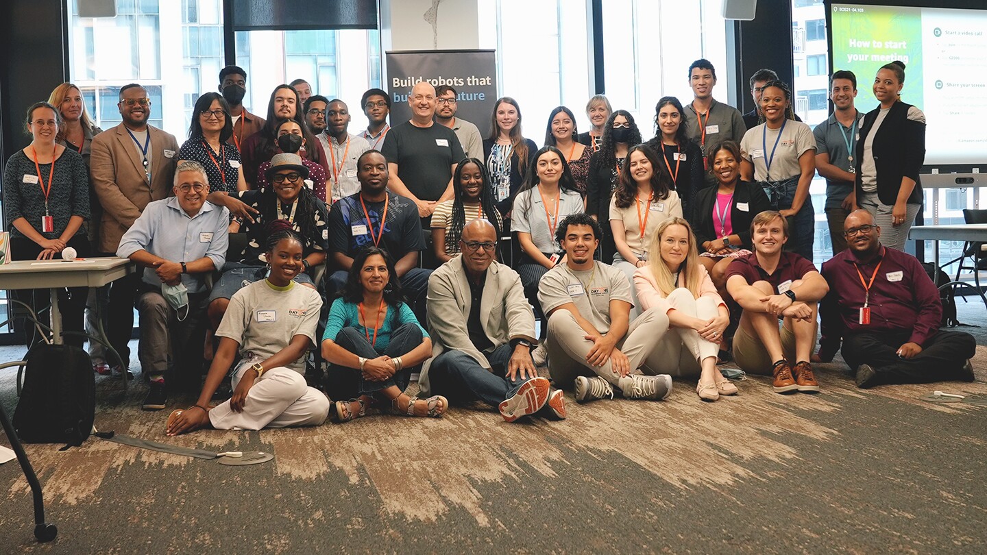 Participants in the Amazon Robotics Day One Fellowships Summit pose for a group picture