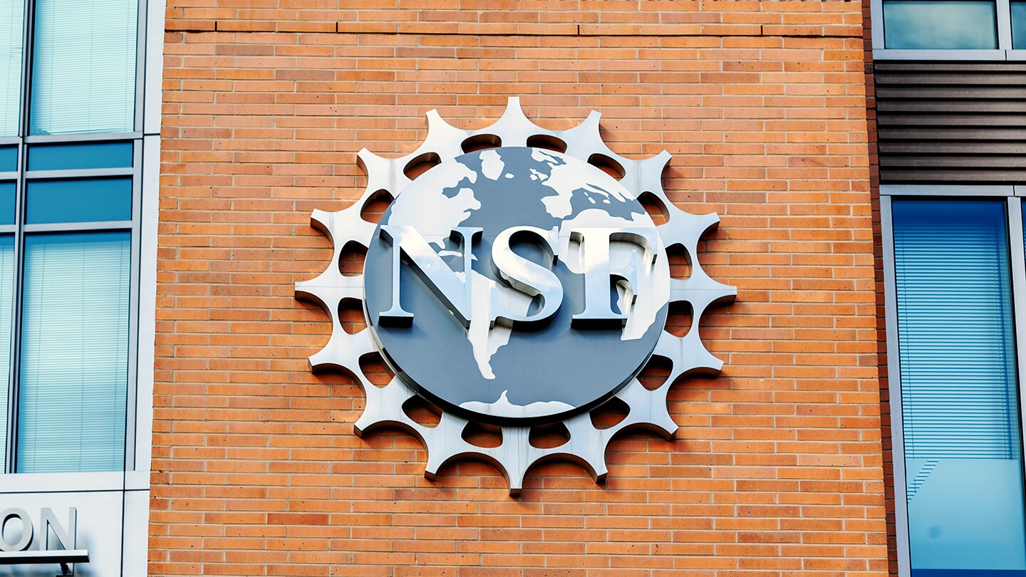 The National Science Foundation logo is seen on an exterior brick wall at NSF headquarters