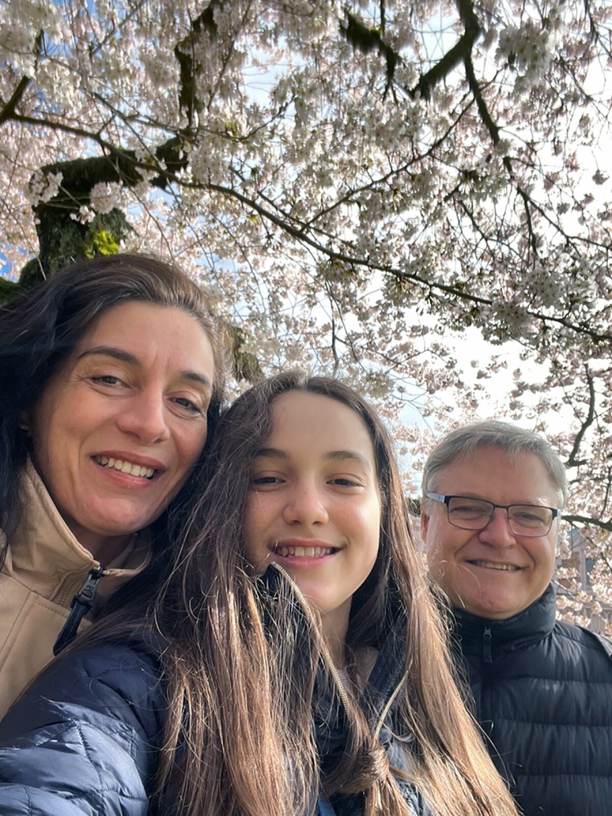 Luciana Buriol is seen in a selfie with her daughter and husband