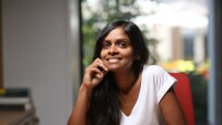 Shipra Agrawal, seated at a desk with a hot beverage