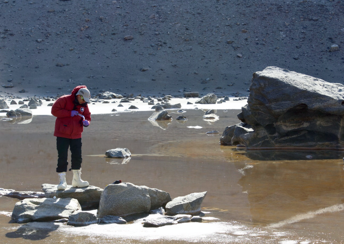 Jonathan Toner is seen here at Don Juan Pond, a shallow hypersaline lake in Antartica