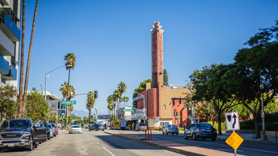 A view of the building from the palm tree-lined streets of Culver City, CA 