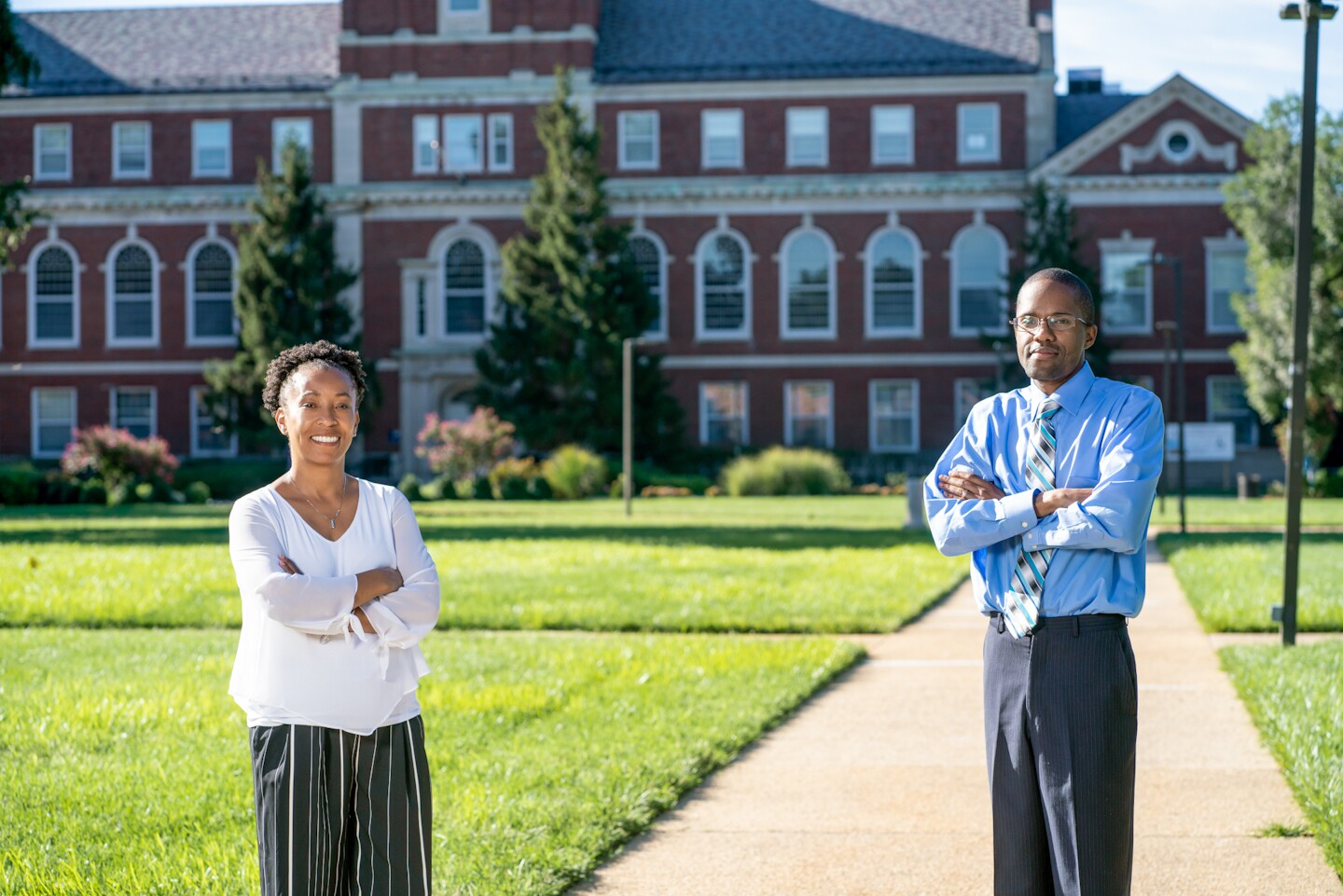 Rhonda Vonshay Sharpe and Omari H. Swinton standing in front of Howard University.