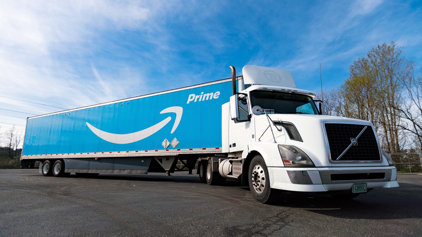 The photo shows an Amazon truck parked with the company logo and the word prime painted on the side