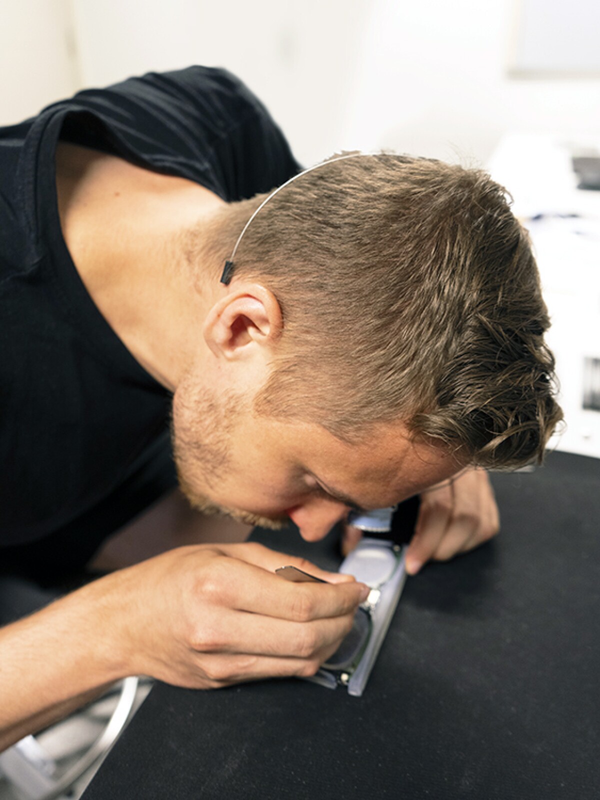 A Pixieray employee is seen working on a part of a prototype
