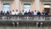 Politecnico di Milano professor Stefano Ceri, third from right, and some of his team are pictured here standing on a stone balcony