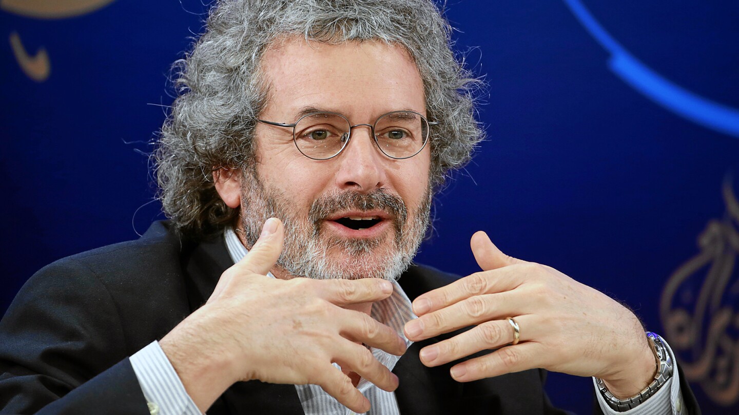 Neil Gershenfeld, the director of the Center for Bits and Atoms at MIT, gestures while speaking