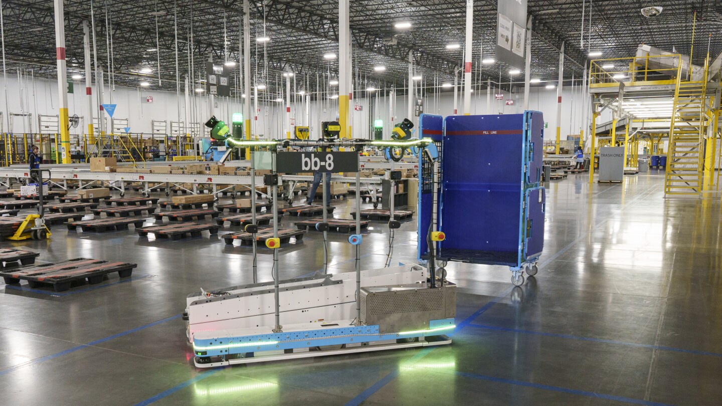 Inside  (AMZN) Flagship Fulfillment Center Where Machines