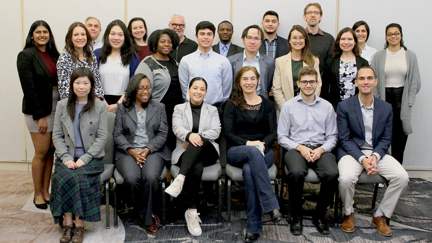 Image shows a group shot of Amazon scientists and the SCOT/INFORMS Scholars at a welcome breakfast 