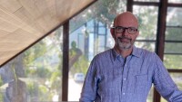 Alex Guazzelli, director of machine learning in Amazon’s Customer Trust and Partner Support unit, stands in front of a window