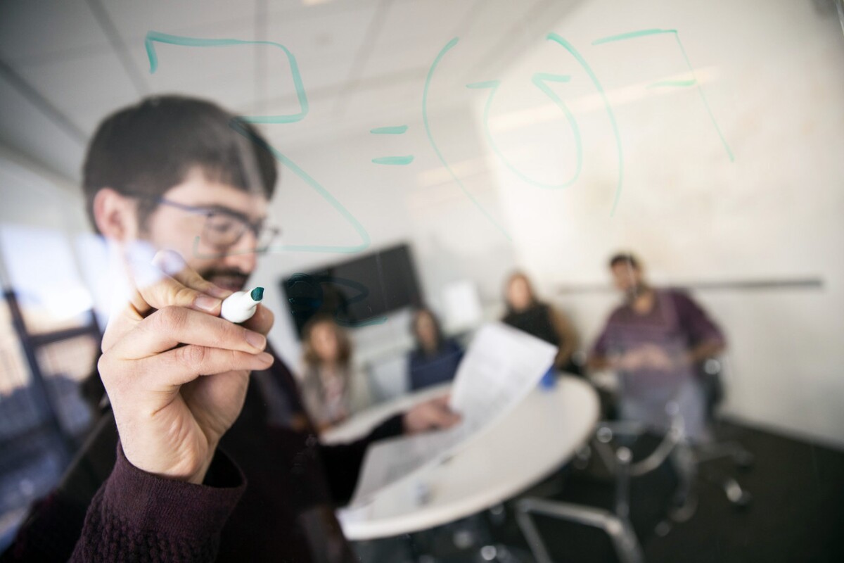 Virginia Tech College of Engineering students and faculty are seen collaborating on research projects at the Sanghani Center for Artificial Intelligence and Data Analytics.